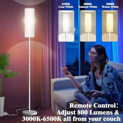 The Qaubauyt lamp glowing in a purple RGB mode beside a bed at night