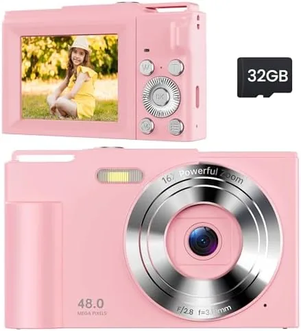 The pink kids digital camera held in a child's hands
