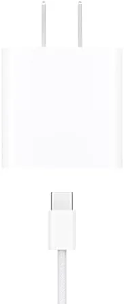 Adapter plugged into a wall outlet beside a folded USB-C cable