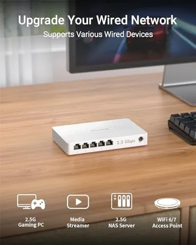 The switch mounted under a desk with neatly organized ethernet cables