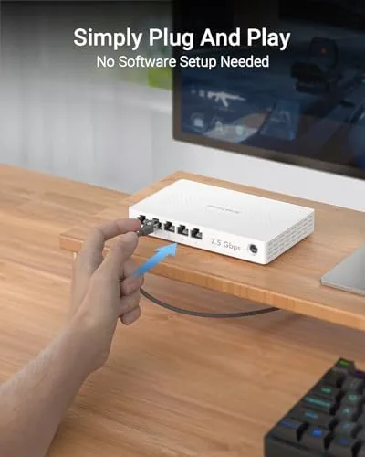 The BrosTrend switch next to a gigabit switch and an 8 port multi-gig switch