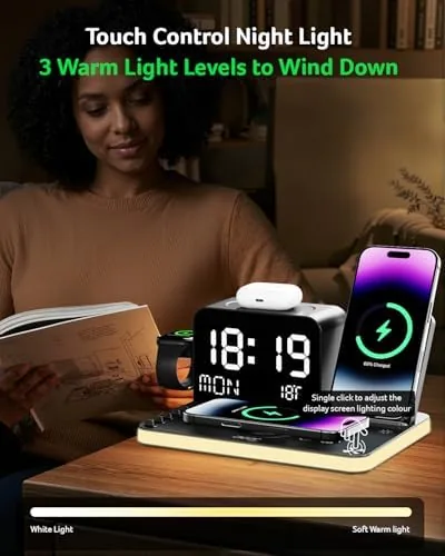 The charging station cables routed behind a clean desk setup with the clock display lit