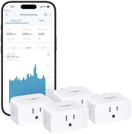 The four Tapo P110M smart plugs arranged in a row beside a phone running the Tapo app