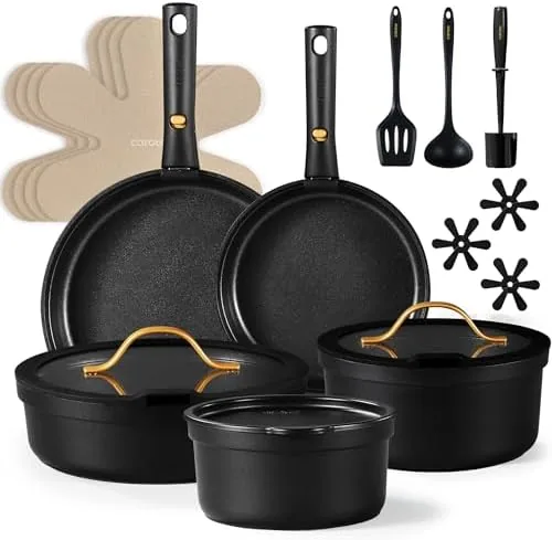 The CAROTE 20 piece cookware set spread out on a kitchen counter with the handles detached