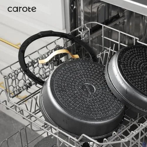The nested cookware set packed into a travel crate beside an RV kitchen cabinet