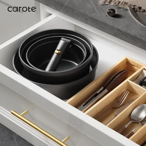 The detachable handle being released and the pan being wiped clean after cooking