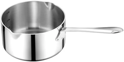 The 20 ounce stainless steel milk pot sitting on an induction cooktop