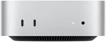 Compact 2024 Mac mini M4 Pro on a desk next to a monitor