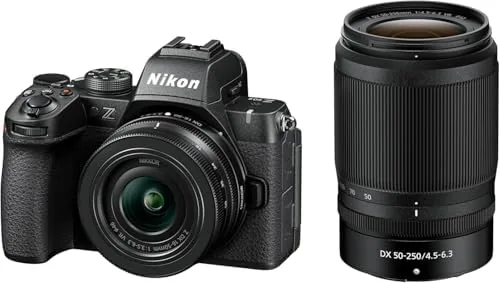 Both zoom lenses collapsed and laid out next to the compact camera body
