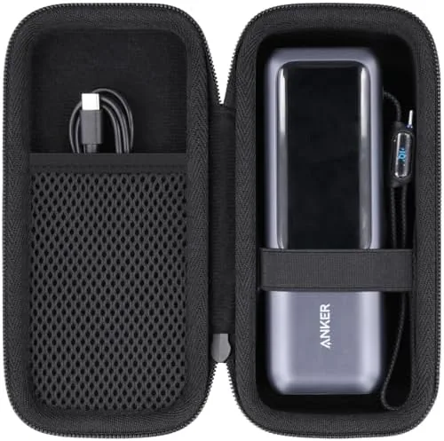 The black co2CREA hard case closed on a table with the wrist strap attached