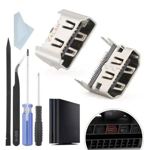 Two replacement PS4 HDMI ports and the included repair kit on a workbench