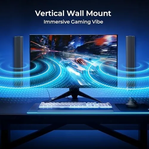 The two detached halves of the sound bar placed at either side of a monitor