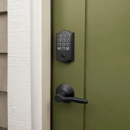 A hand unlocking the matte black deadbolt with a keypad code