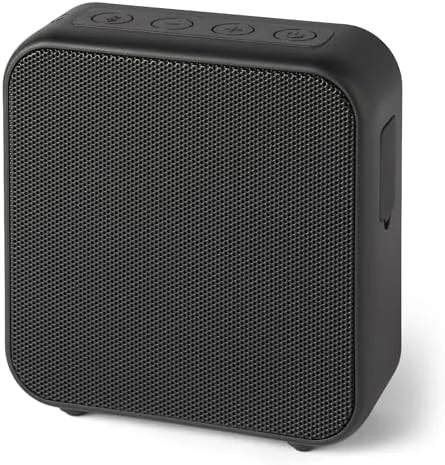 The Amazon Basics Bluetooth speaker standing on a kitchen counter