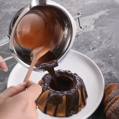Smooth melted chocolate being poured from the bowl into a mold