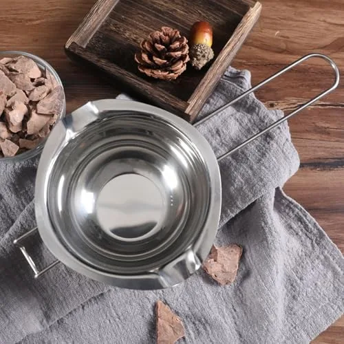 Finished chocolate truffles beside the cleaned melting bowl