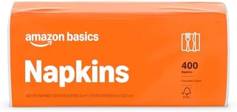 A stack of Amazon Basics paper napkins on a kitchen table