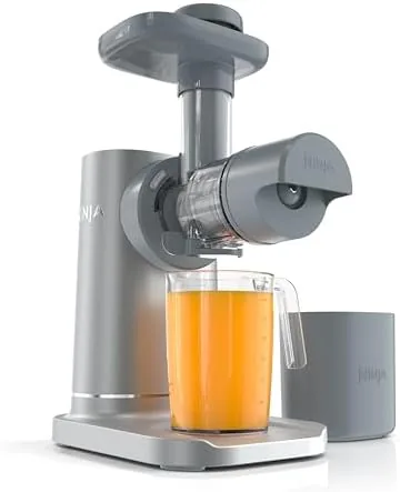 The silver Ninja NeverClog cold press juicer assembled on a counter