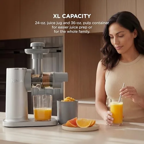 The juicer parts arranged on a dishwasher rack after a cleaning test