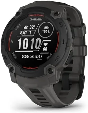 The Garmin Instinct E charcoal smartwatch on a wrist outdoors