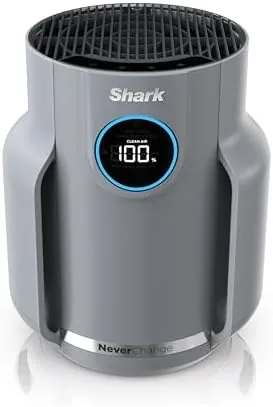 Shark NeverChange Compact Pro air purifier in Winter Fog on a bedside table