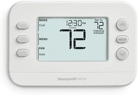 Honeywell Home X2P programmable thermostat in white on a hallway wall