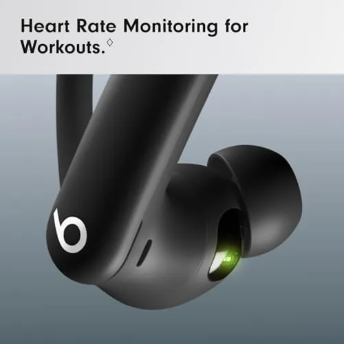 Charging case holding the earbuds next to a phone on a bench