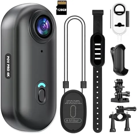 The thumb sized 4K mini WiFi action camera held next to a hand to show its scale