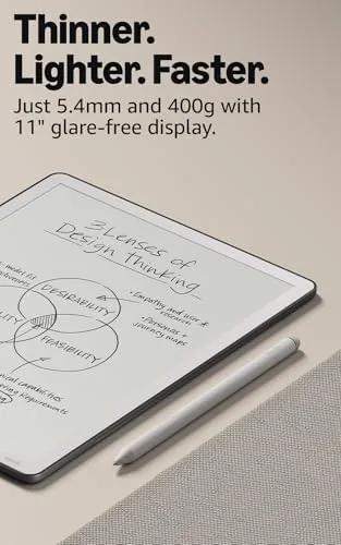 A hand writing notes in a lined notebook on the Kindle Scribe with the Premium Pen