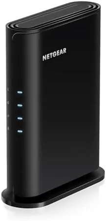 The NETGEAR R6700AX WiFi 6 router standing upright on a shelf with antennas raised