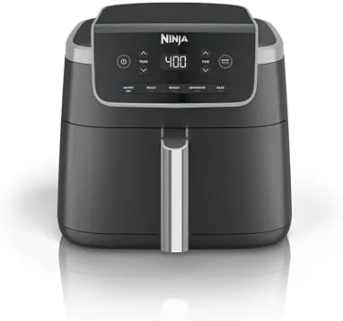 The grey Ninja Air Fryer Pro with the basket pulled out showing golden fries