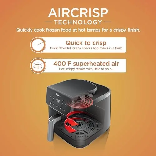 A chicken roasting inside the Ninja Air Fryer Pro basket with the drawer open