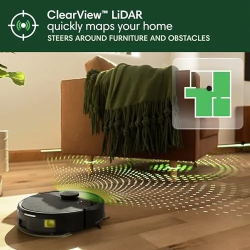 A Roomba 105 Combo docked and charging beside a wall in a living room