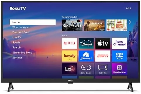 The Roku 32-inch Select Series television on a small nightstand in a bedroom