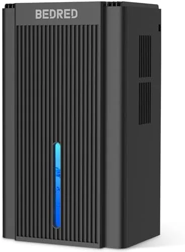 The 95OZ dehumidifier standing in a bedroom corner with the ambient light glowing