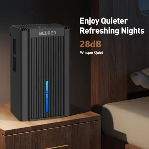 The dehumidifier running in a living room with the ambient light on a low glow