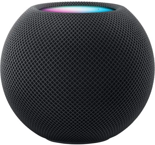 Apple HomePod mini Space Gray sitting on a kitchen counter