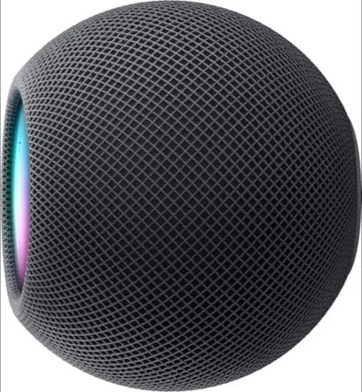 HomePod mini paired in stereo on a shelf with music playing