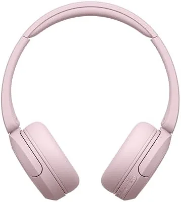 Pink headphones folded flat and packed in a bag