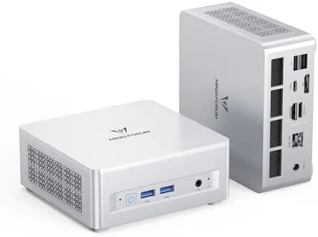 The MINISFORUM UM880 Plus mini PC on a desk next to a monitor and keyboard