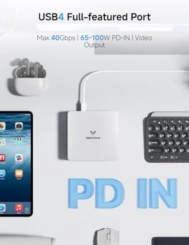 The mini PC mounted behind a monitor on a VESA bracket in a home office