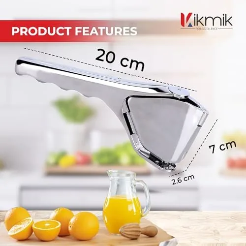 A glass of lemonade being made with juice from the squeezer