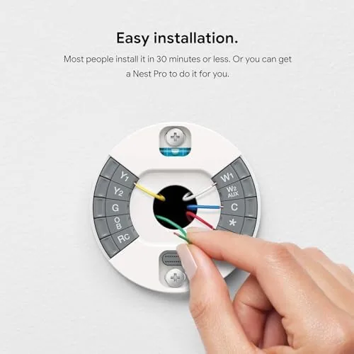 The thermostat with the Nest app open showing the monthly energy report