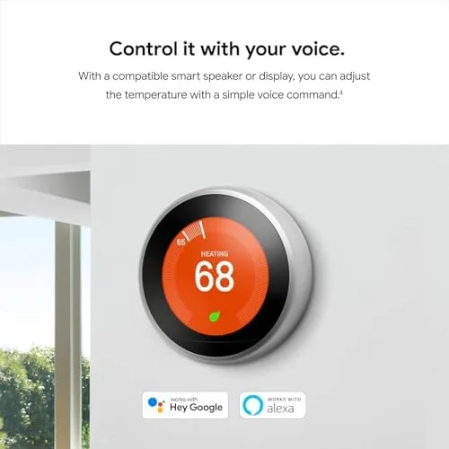 The thermostat on the wall with the app open on a phone showing the schedule