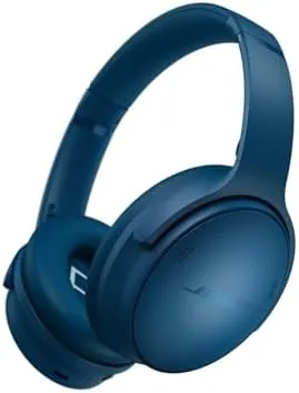 Bose QuietComfort headphones in Twilight Blue resting on a desk