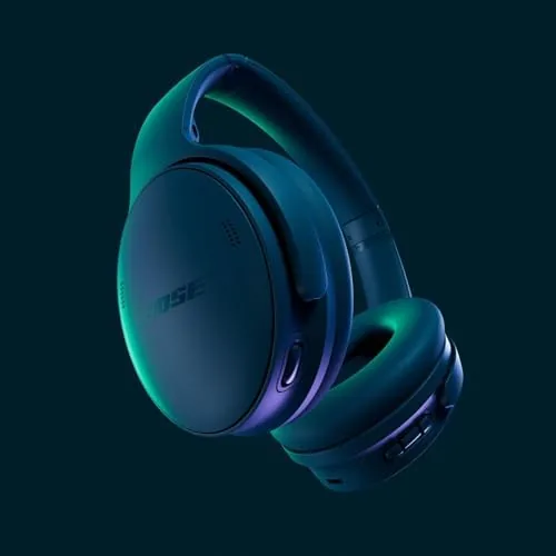 Commuters wearing the Bose QuietComfort headphones on a train with calm expressions