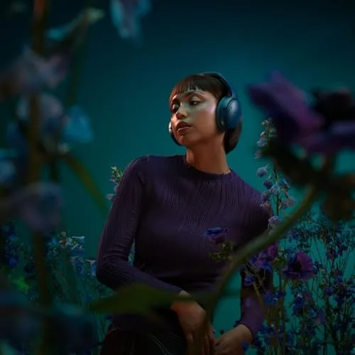 The Bose headphones worn during a video call with the microphone in use