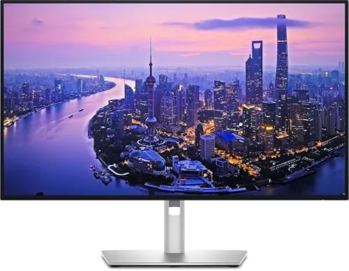 Dell UltraSharp U2725QE monitor on a desk with a laptop connected by USB-C