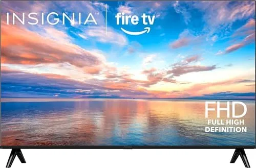 The INSIGNIA 40 inch FE Series Fire TV mounted on a wall showing a streaming home screen