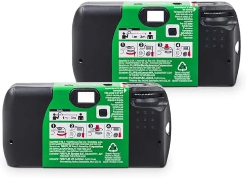 The two QuickSnap cameras packed into a travel bag with other travel items